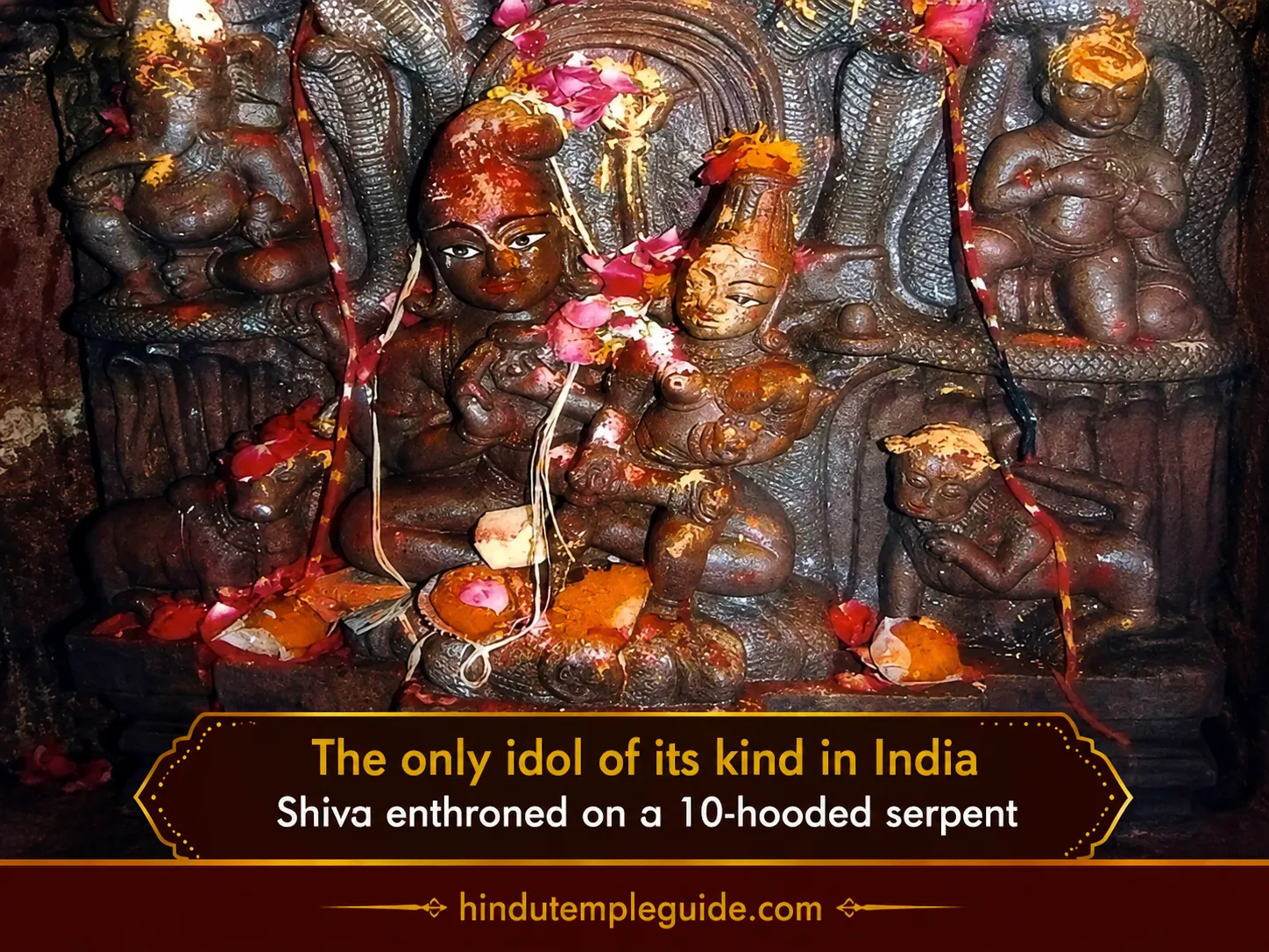 Lord Shiva seated on ten-hooded serpent throne sanctum decorated with flowers at Nagchandreshwar Temple.